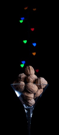 Glass of  walnut with heart bokeh