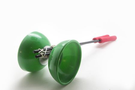 green diabolo close-up isolated over whiteの写真素材
