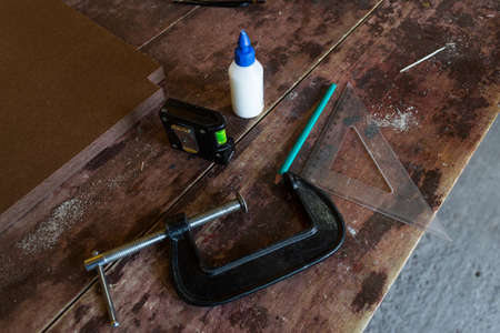 Tools, hammer, wood, mask, press, glue, glue, work table.