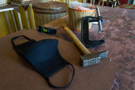 Tools, hammer, wood, mask, press, glue, glue, work table.の写真素材