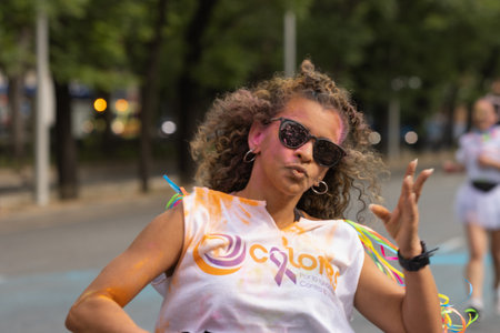 Madrid, Spain, Athletes running in a race with colored powders through the streets of Madrid against violenceのeditorial素材