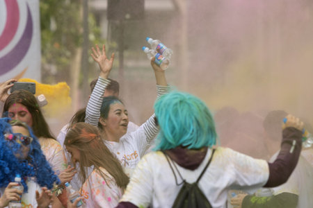 Madrid, Spain, Athletes running in a race with colored powders through the streets of Madrid against violenceのeditorial素材