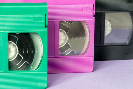 Green, pink and black VHS cassettesの写真素材
