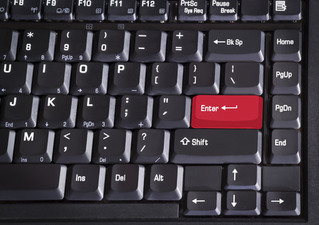 Closeup red enter button of computer keyboardの写真素材
