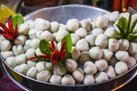 Pork balls decor with red and green chilliの写真素材