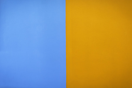 Contrast painted blue and orange color wall background
