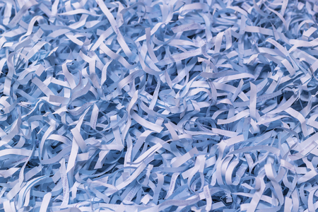 Closeup blue paper strips from a shredderの写真素材