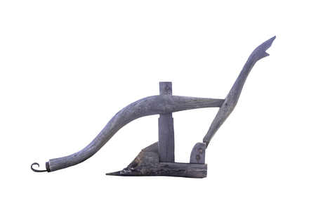 Ancient wooden plough handle isolated on whiteの写真素材