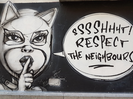 belgium in a street in black and white female cat cartoon graffiti pointed to a quiet zoneのeditorial素材