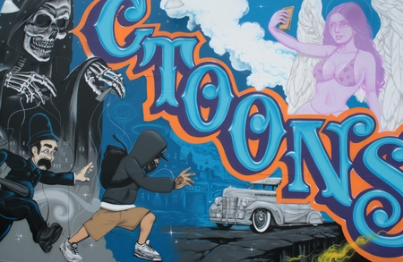 Cooney Island graffiti near the amusement park â  "a policeman chasing a boy making graffitiのeditorial素材
