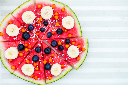 Vegan Snack from Watermelon, Fruits and Berries - blueberry, shredded coconut, bananas,  Seabuckthorn berriesの写真素材