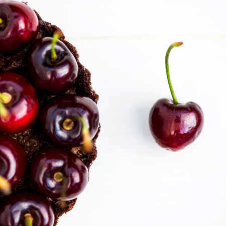 Homemade Raw Vegan Cherry Tart with Cherry on the foreground, macro shot, selective focus, shallow DOFの写真素材