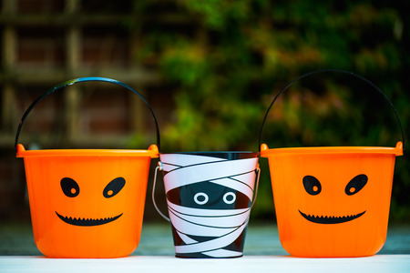 Child Trick or Treat Empty Halloween Buckets are Ready for the Candy Treats, Pumpkin and Mummy Styleの写真素材