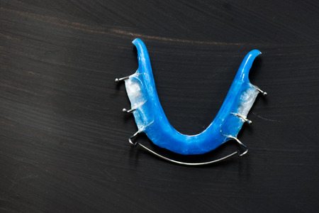 Dental Blue Removable Braces or Retainers for Teeth, Orthodontic on Dark Grey Background