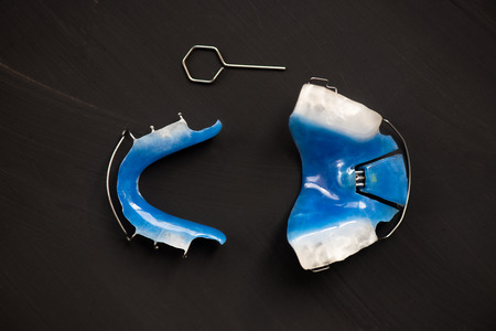 Dental Blue Removable Braces or Retainers for Teeth, Orthodontic on Dark Grey Background