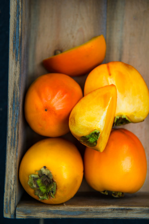 Close up of Ripe Persimmon Fruits, selective focus, shallow DOFの写真素材