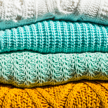 Stack of Cozy Cotton Knitted Sweaters, Close Up Image