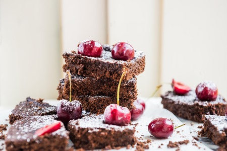Healthy Double Chocolate Brownies with Cherries. Made from Banana, Wholewheat and Coconut Flour and Maple Syrup. Vegan concept. Top View, marble backgroundの写真素材