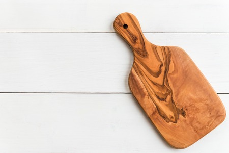 Chopping Board from Olive Wood on light background, top view, copy spaceの写真素材