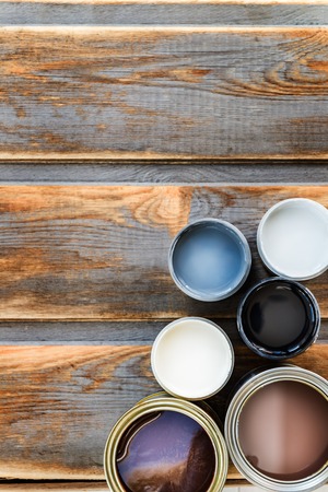 Preparation for the renovation of the Wooden Box with Open Cans of Different Paints, Varnish and Stainの写真素材