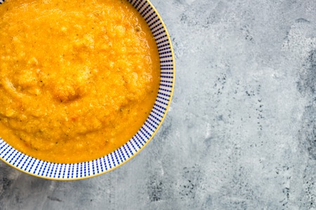 Vegetarian Soup from carrots, tomatoes, brocolli and chickpeas, light backgroundの写真素材