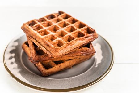 Chocolate Belgium Waffles freshly made at home 
on the Light Backgroundの写真素材