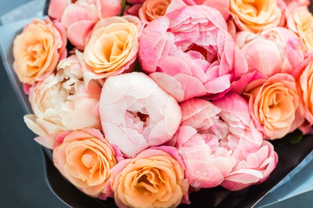 Fresh bunch of pink peonies and roses. Card Concept, pastel colors, close up imageの写真素材
