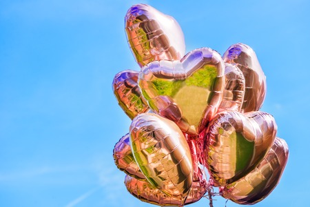 Bunch of Heart shaped ballons on the sky backgroundの写真素材