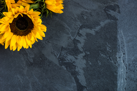 Yellow Sunflower Bouquet on Grey Grunge Background, Autumn Concept, Top View, Space for Textの写真素材