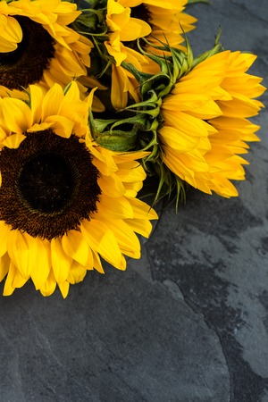 Yellow Sunflower Bouquet on Grey Grunge Background, Autumn Concept, Top View, Space for Textの写真素材
