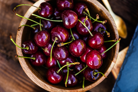 Fresh Ripe Cherries in the wooden bowl