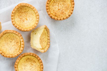 Free range Egg Custard Tart, traditional English, Portuguese, Chinese dessert, on grey backgroundの写真素材