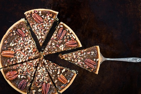 Pecan Pie, made from butter enriched pastry with golden syrup, maple sauce and breadcrumbs, topped...