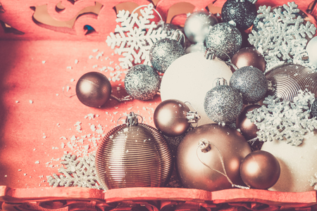 Christmas balls in red wooden box as preparation for decorating xmas tree. Pastel Colors, toned imageの写真素材