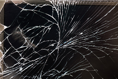 Broken screen of the cellphone or smartphone. Black cracked Touch Screen Phoneの写真素材