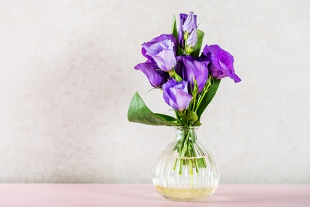 Beautiful Bouquet of Purple Eustoma flowers, Lisianthus, light backgroundの写真素材