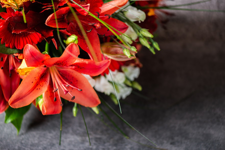 Vibrant Bouquet of orange Asiatic lilies and other flowersの写真素材