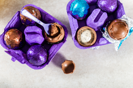 Easter composition from chocolate eggs with a soft vanilla flavour mousse filling and biscuit piecesの写真素材