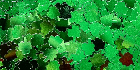 St Patricks Day Symbols such as shamrocks, horseshoes, leprechauns, coins and hats. Confetti...