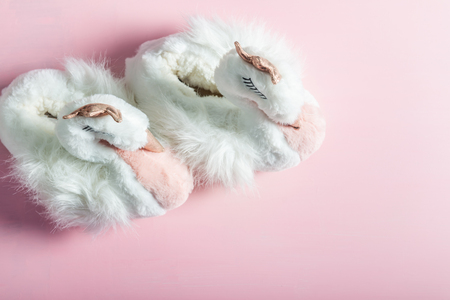 Cute soft 3d swan slippers, standing on the pink backgroundの写真素材