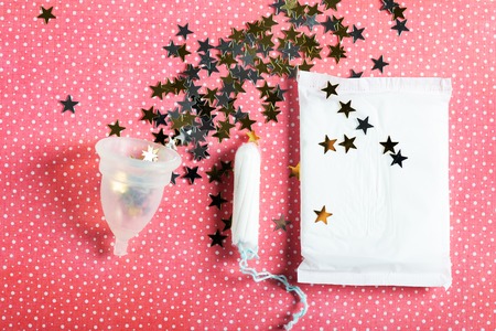 Hygiene items for womens critical days, such as pad, menstrual cup, tampon. Top view, flat lay, concept of womens health issuesの写真素材