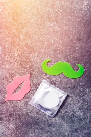 Condom and photo booth props such as lips and moustacheの写真素材