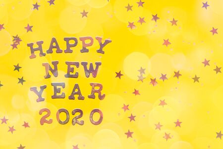Happy New 2020 Year letters on bright yellow background