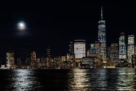 Amazing panorama view on New York City skyline and Downtown Manhattan from Jersey City during nightの写真素材