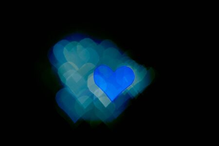 Abstract light, blue bokeh pattern in heart shape. St Valentides Day or Holiday concept, background image.の写真素材