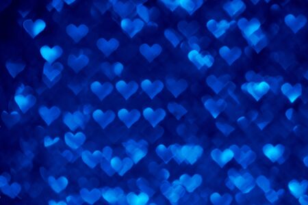 Abstract light, blue bokeh pattern in heart shape. St Valentides Day or Holiday concept, background image.の写真素材