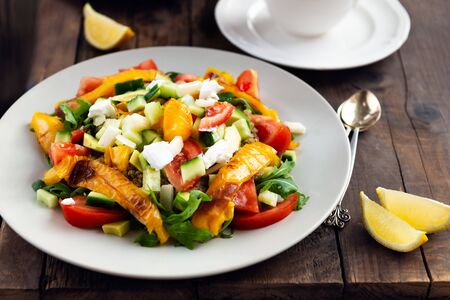 Detox healthy dinner from Quinoa Salad with vegetables such as cucumbers, cherry tomatoes, pepper and goat cheese. Vegetarian food.の写真素材