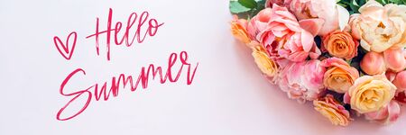 Hello Summer words. Fresh bunch of pink peonies and roses on pink background. Card Concept, pastel colors, close up image, copy space, banner sizeの写真素材