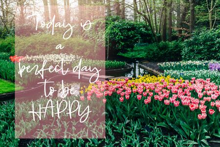 Today is a perfect day to be happy phrase in the frame. Nice curvy path between flowerbeds of blossoming tulips during spring. One of the worlds largest flower gardens in Lisse, the Netherlands.の写真素材