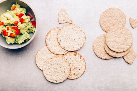 Healthy Gluten Free Snacks. Oatcakes and sea salt crackers with avocado mash